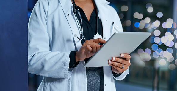 healthcare professional using her laptop